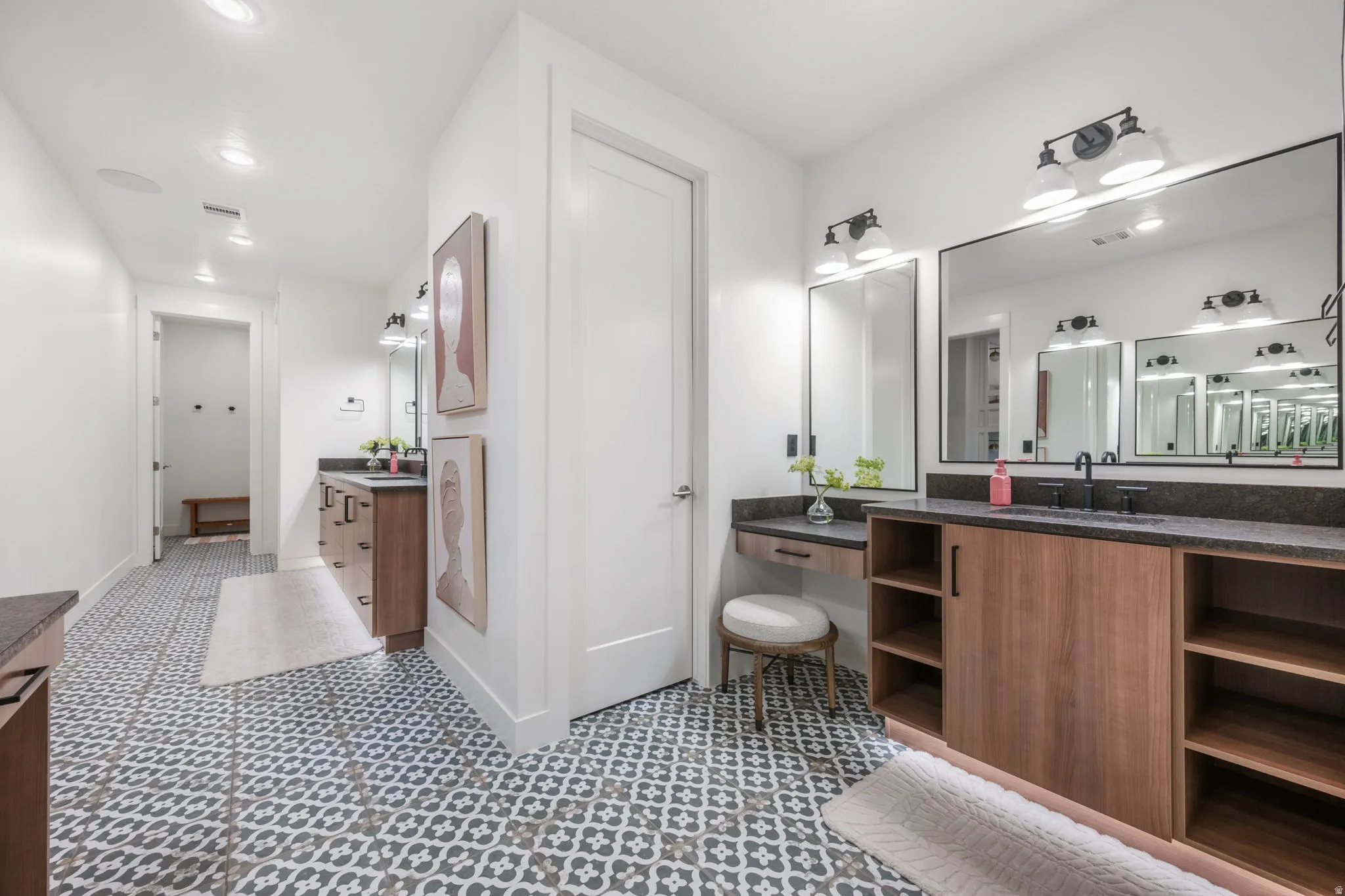 Bathroom with two vanities and recessed lighting