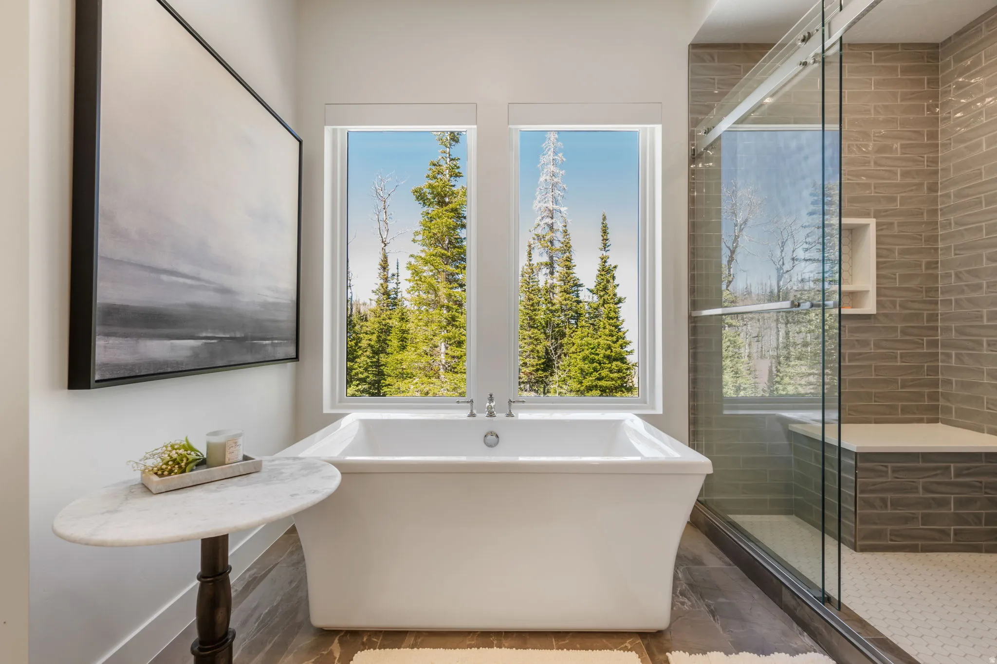 Full bathroom featuring a freestanding bath and a shower stall