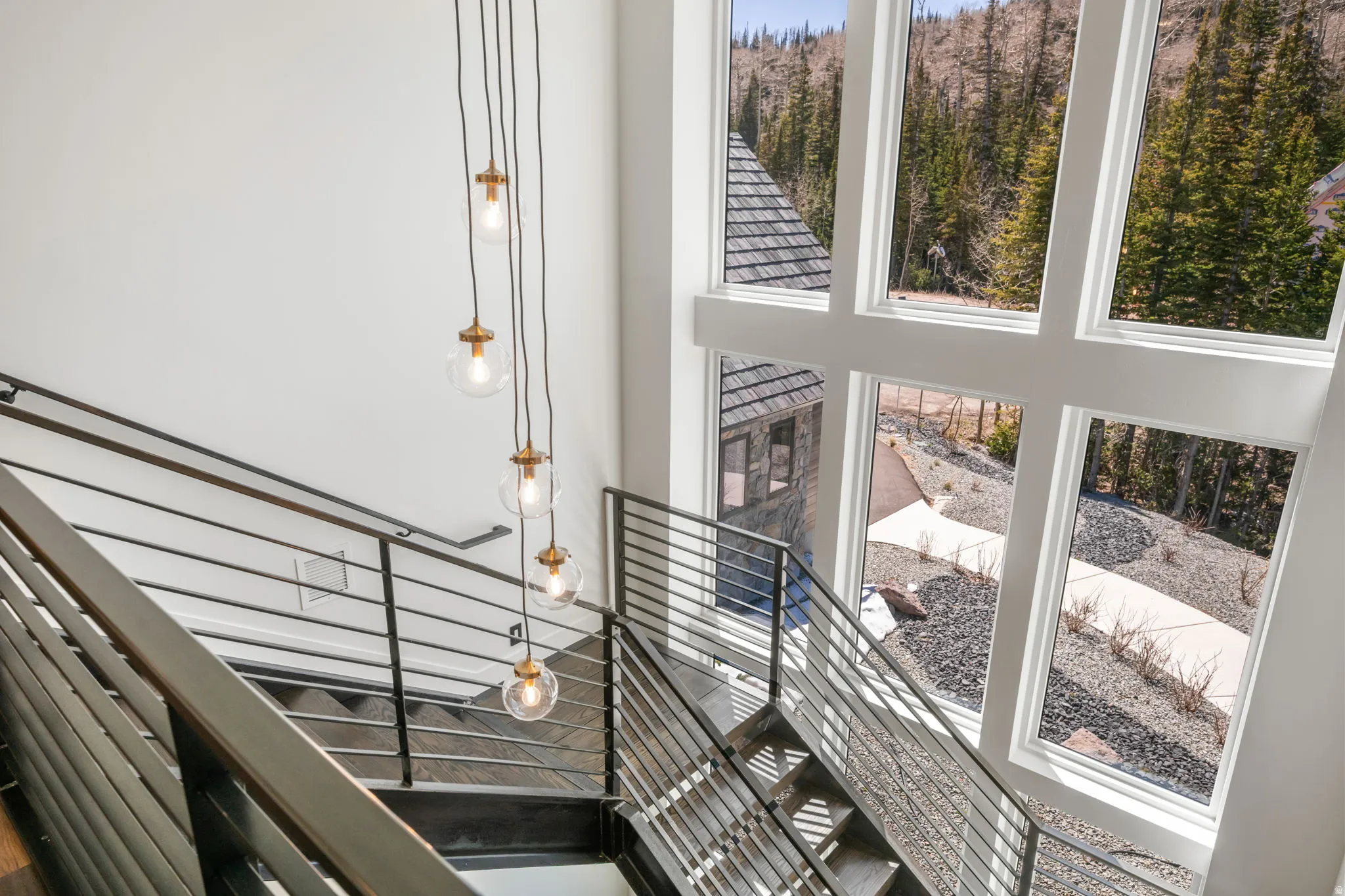 Staircase with a high ceiling and plenty of natural light