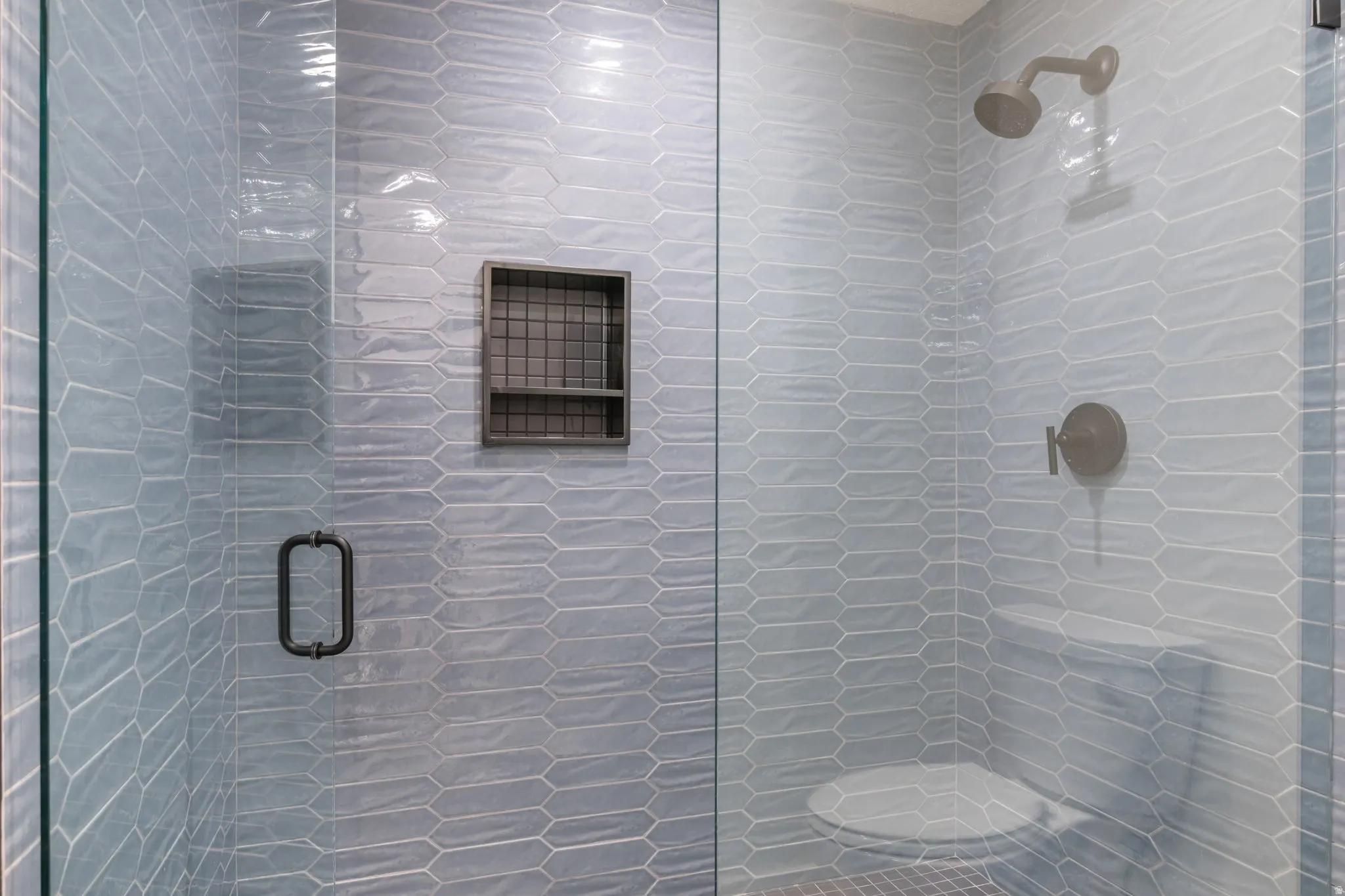 Full bathroom featuring a stall shower