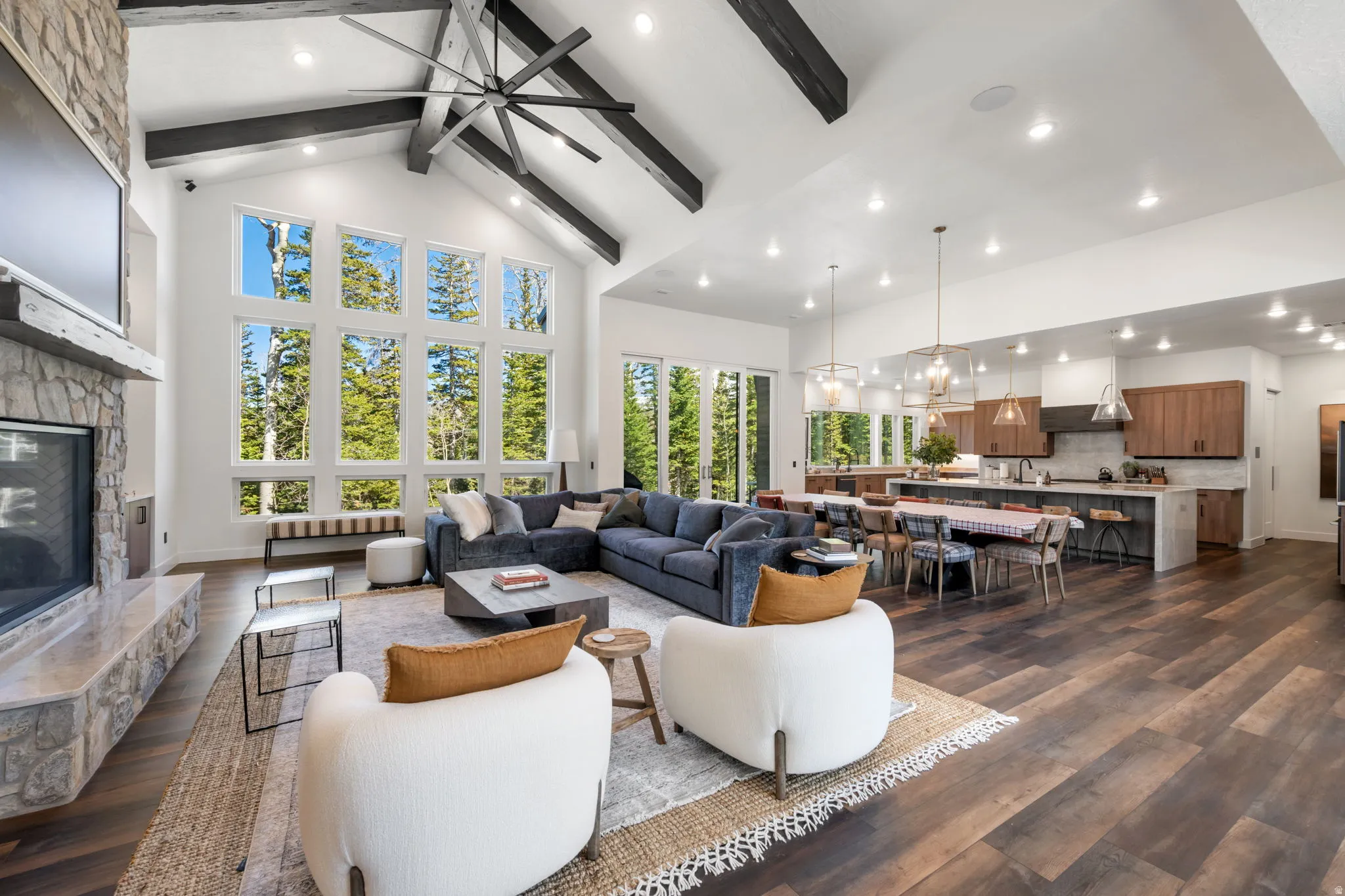 Living area featuring a fireplace, dark wood-style floors, ceiling fan, and recessed lighting