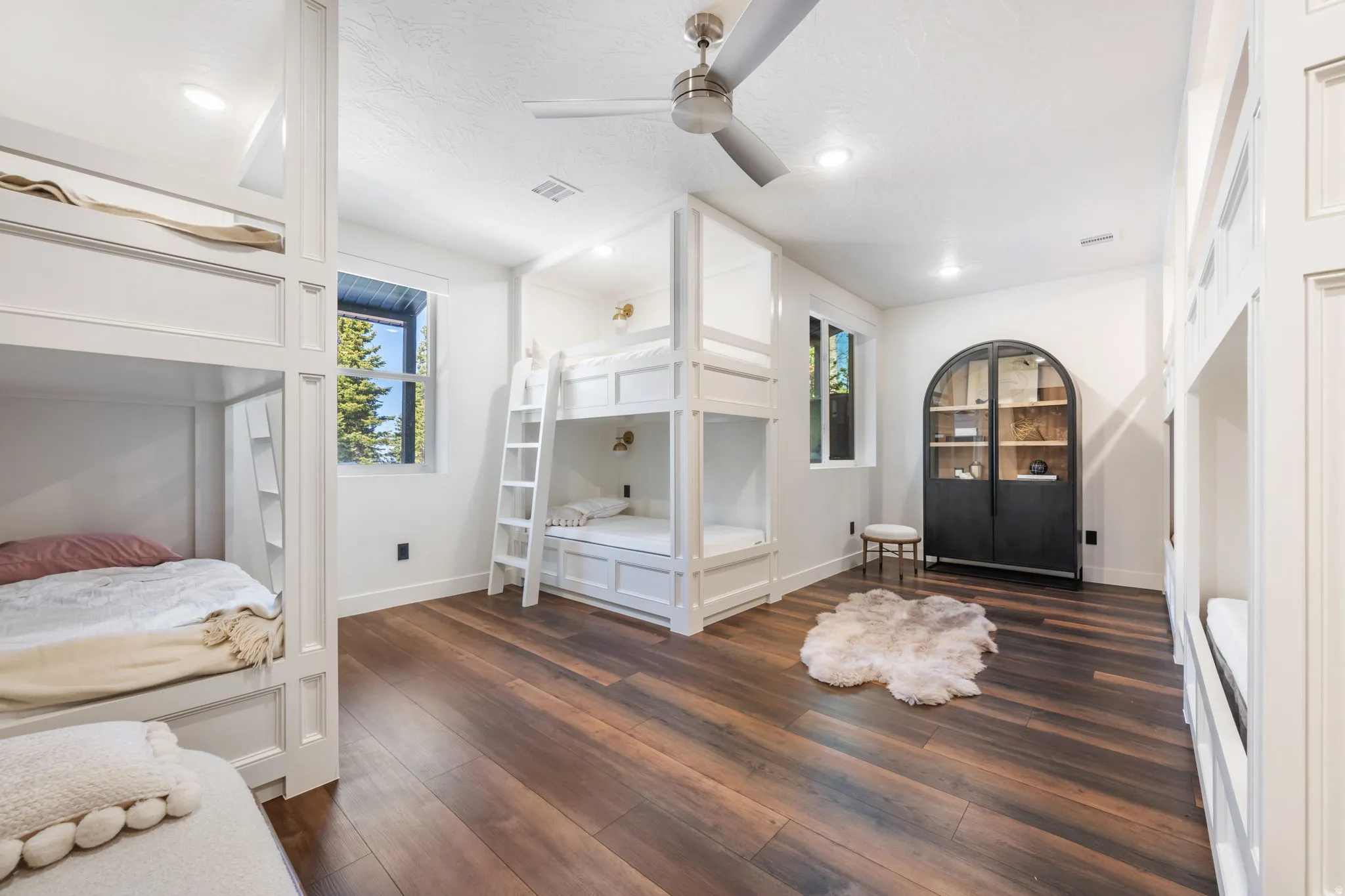 Bedroom featuring dark wood-style floors, a ceiling fan, recessed lighting, and a textured ceiling