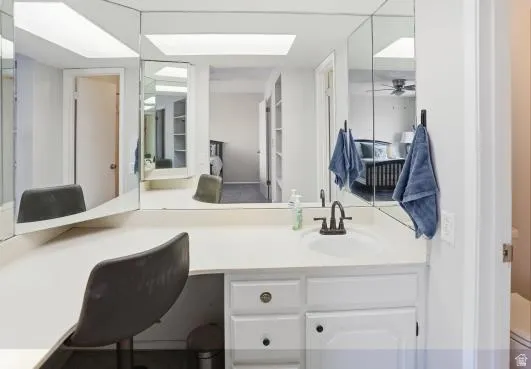 Office area featuring a sink and ceiling fan