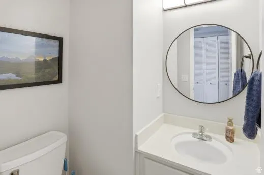 Half bath featuring vanity and toilet