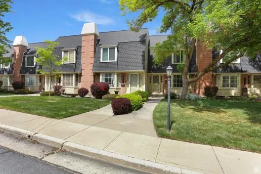 View of front of home featuring a front lawn and a chimney