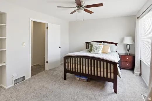 Bedroom with carpet floors and ceiling fan