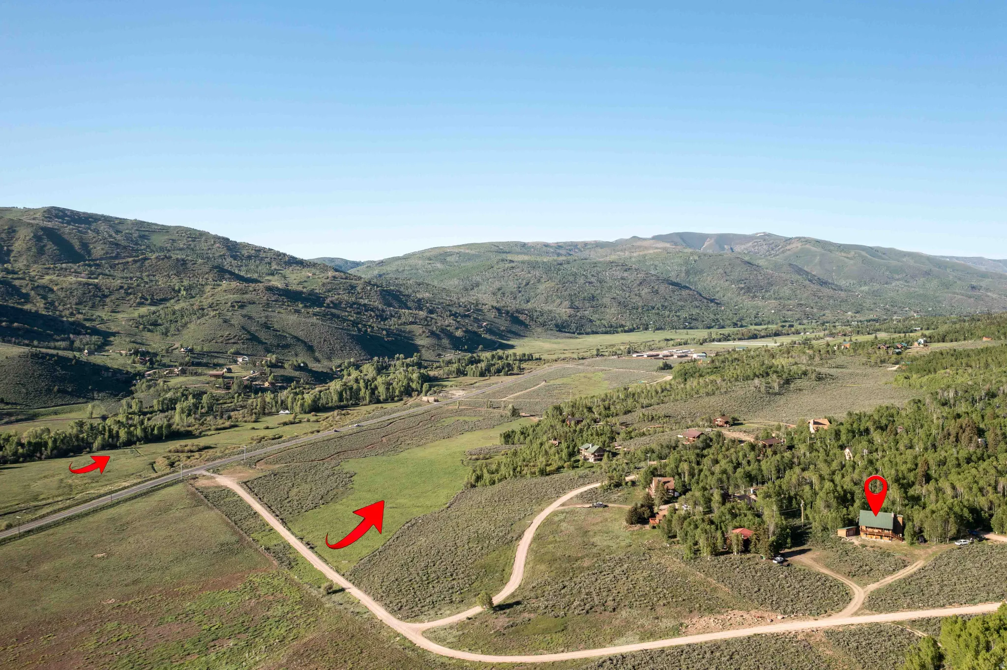View of mountain backdrop with rural landscape