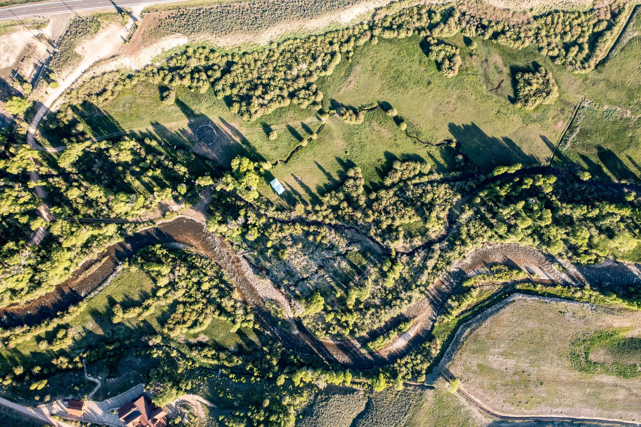 Aerial view of property and surrounding area featuring rural landscape