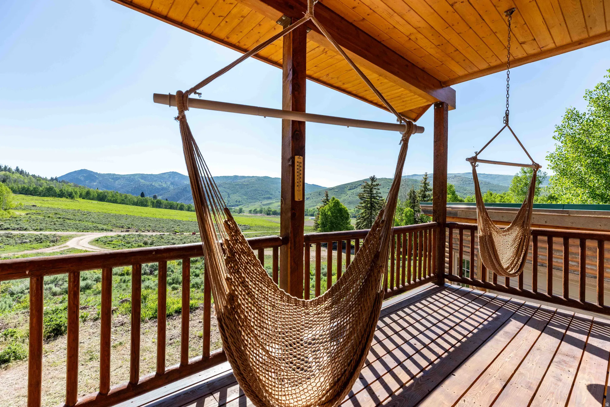 Wooden terrace featuring a mountain view