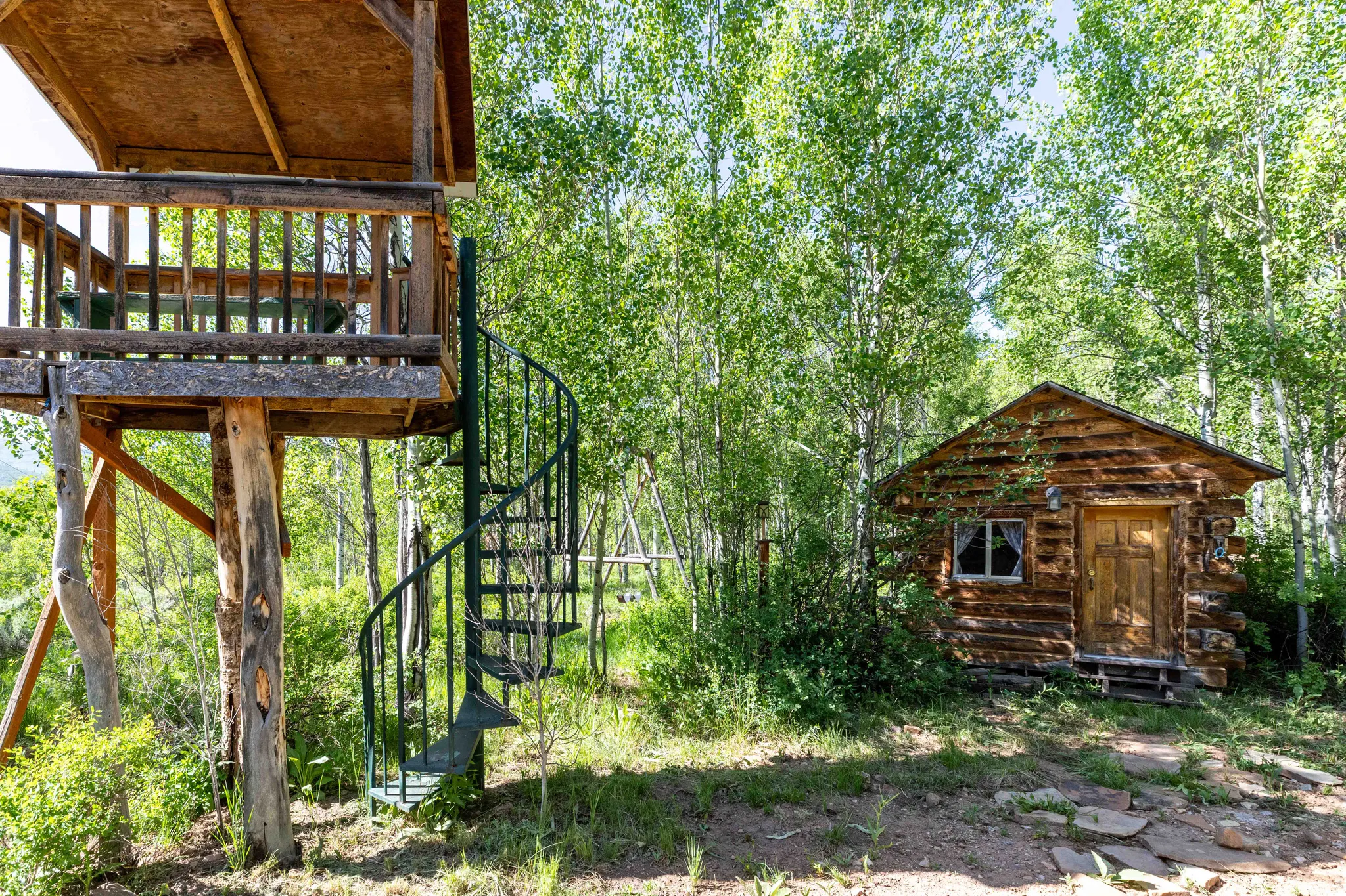 View of yard featuring an outbuilding and stairs