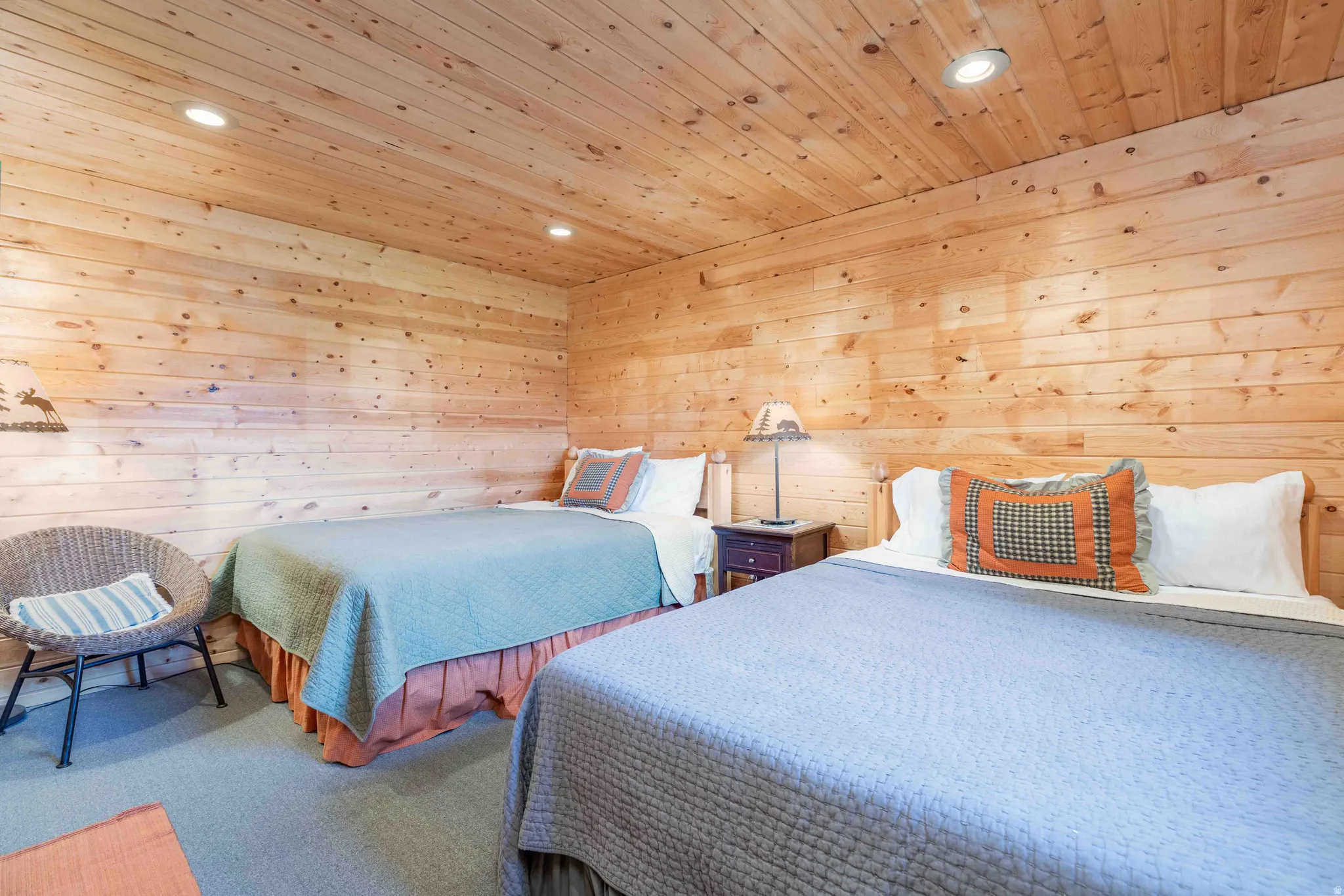 Bedroom featuring wooden walls, carpet, recessed lighting, and wooden ceiling