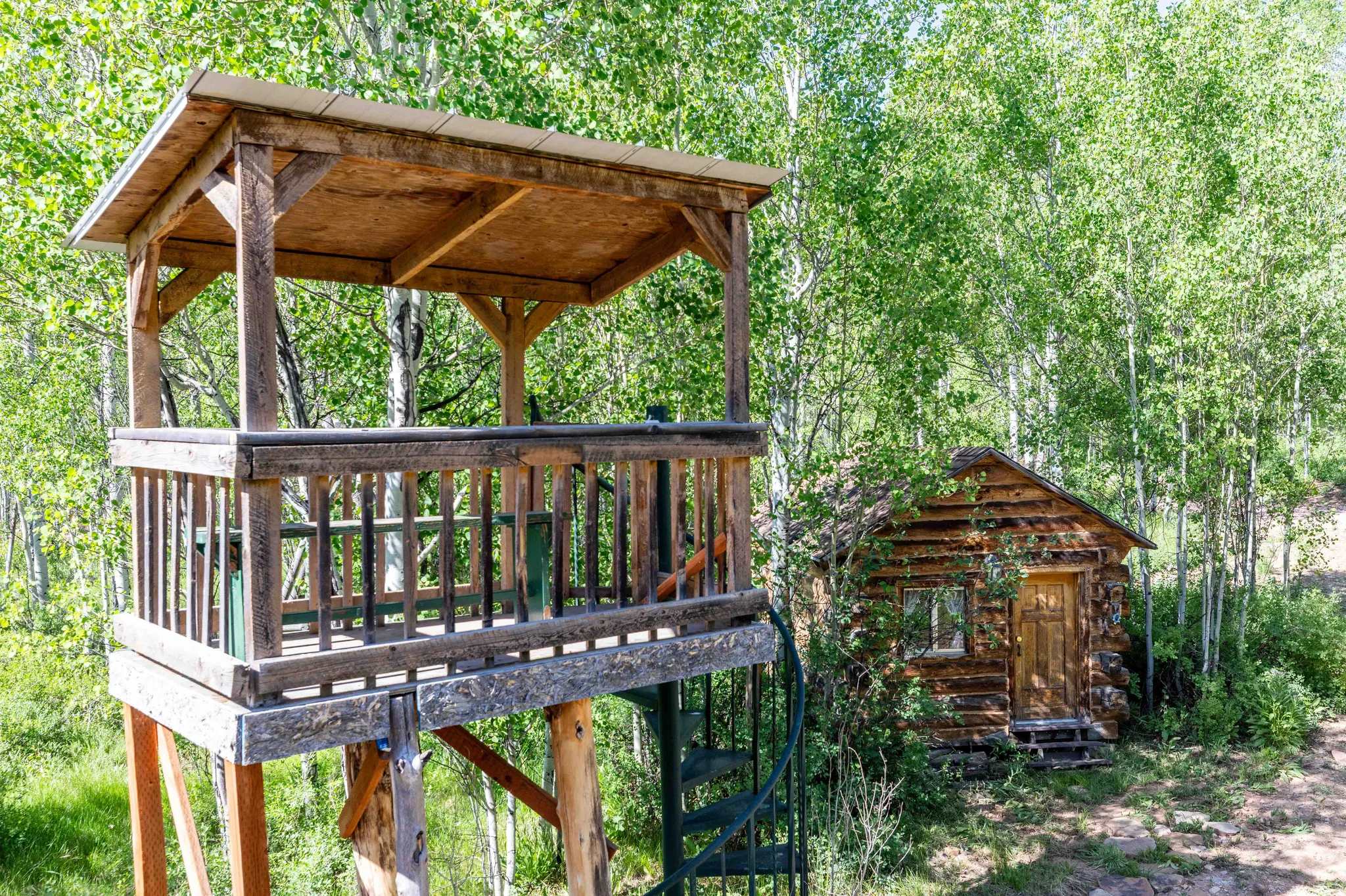 Wooden terrace featuring an outdoor structure