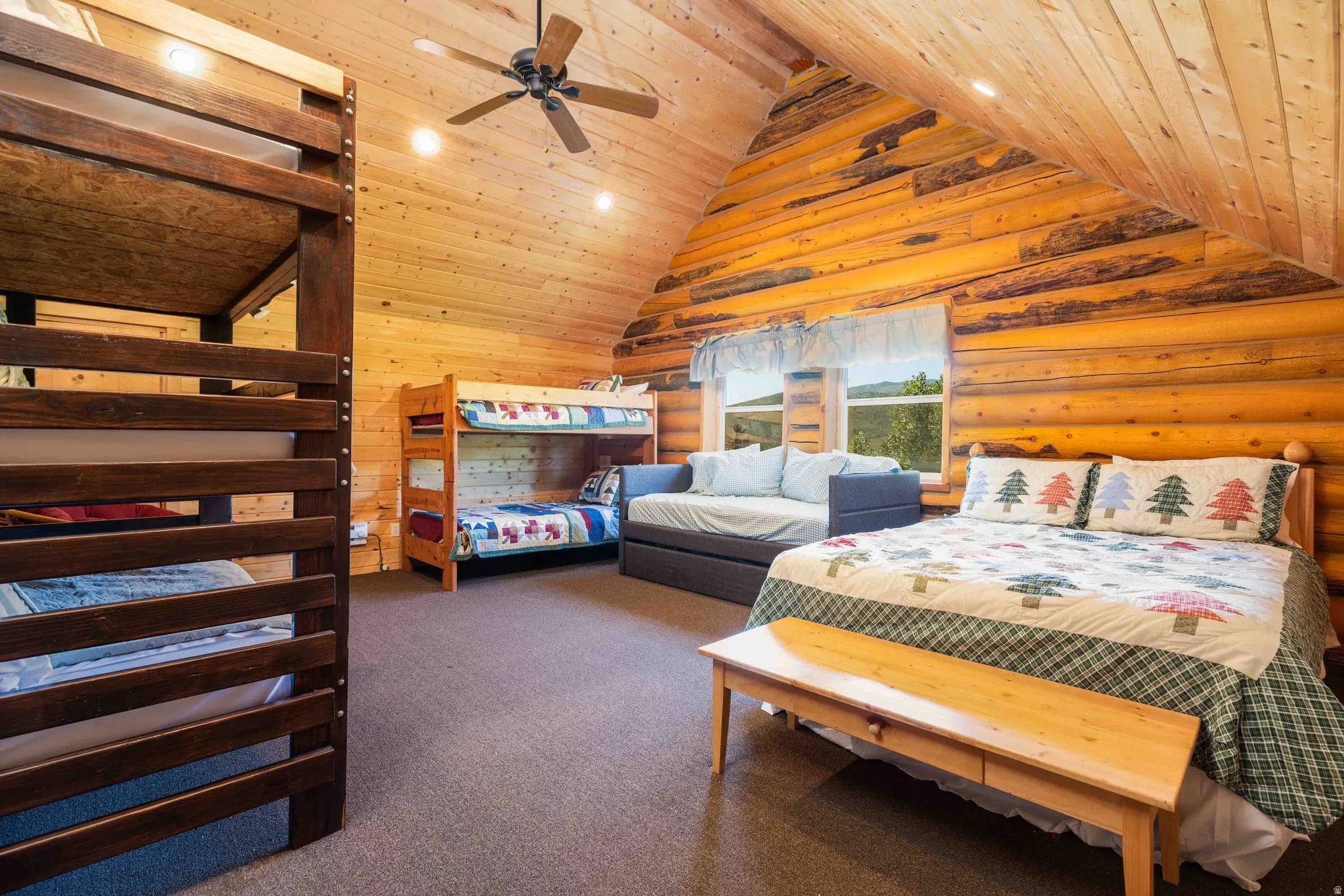 Bedroom featuring carpet floors, wood ceiling, recessed lighting, log walls, and ceiling fan