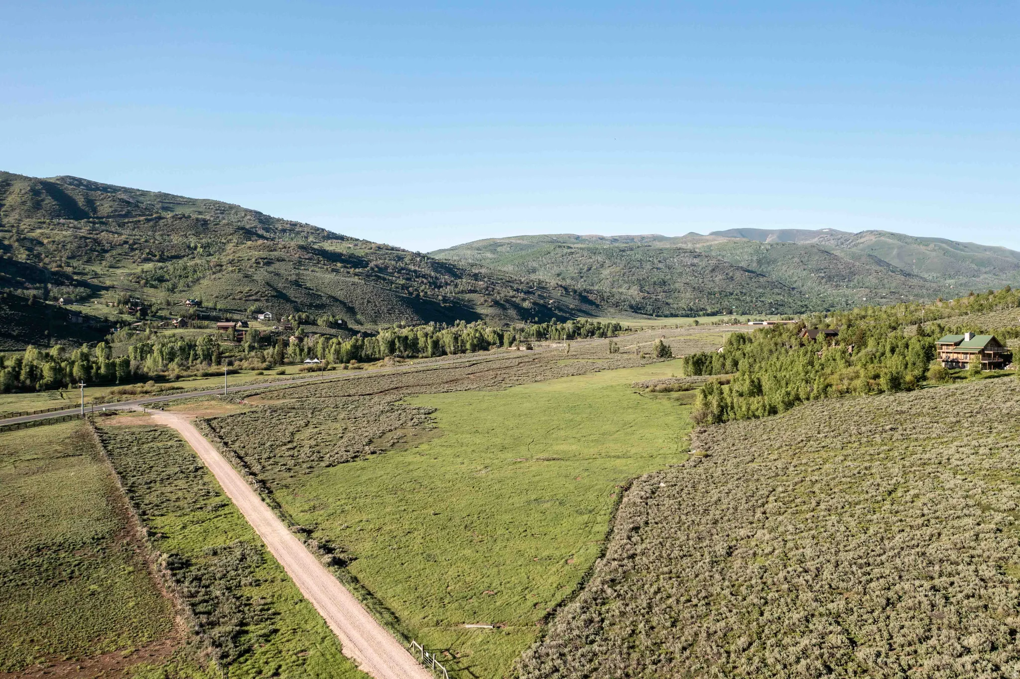 View of mountain backdrop featuring rural landscape