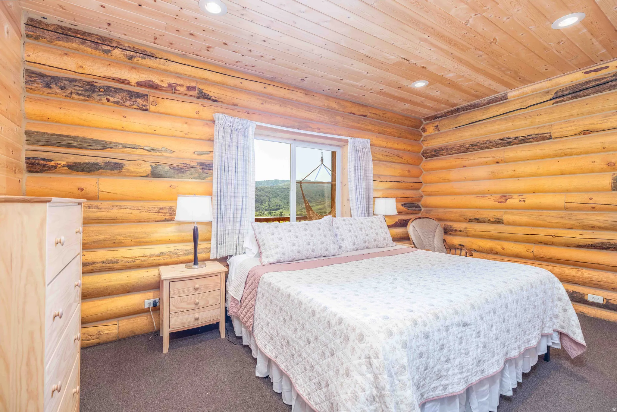 Bedroom with recessed lighting, rustic walls, carpet, and wood ceiling