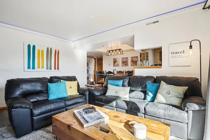 Living room featuring a chandelier