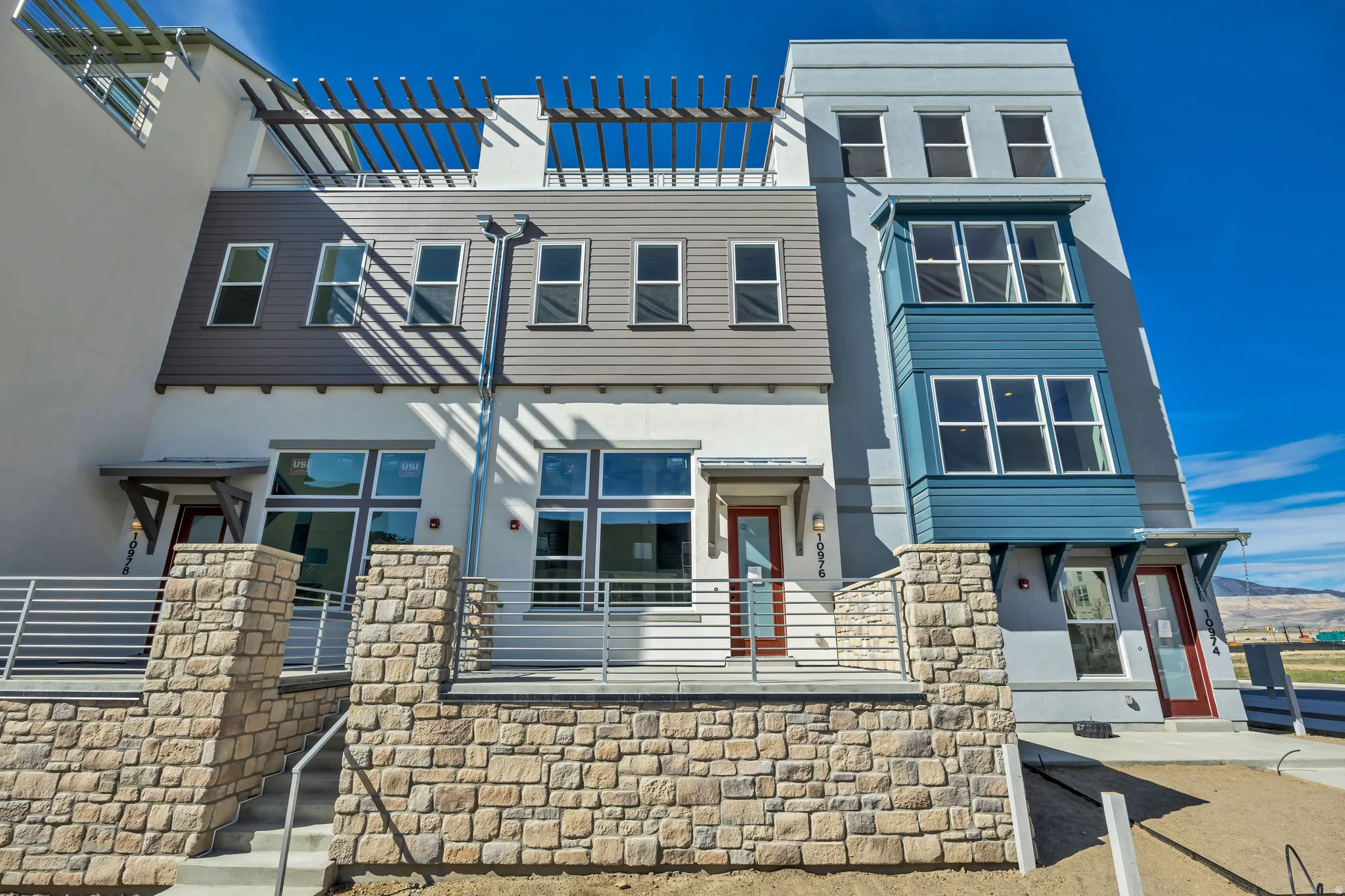 View of front of house featuring stucco siding