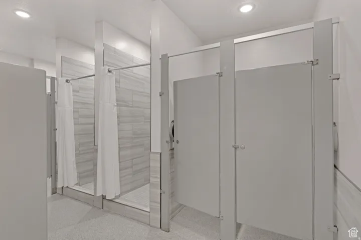 Full bathroom featuring a stall shower and recessed lighting