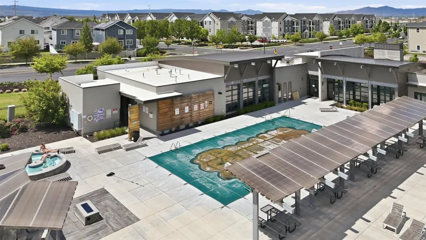 Community pool with a residential view