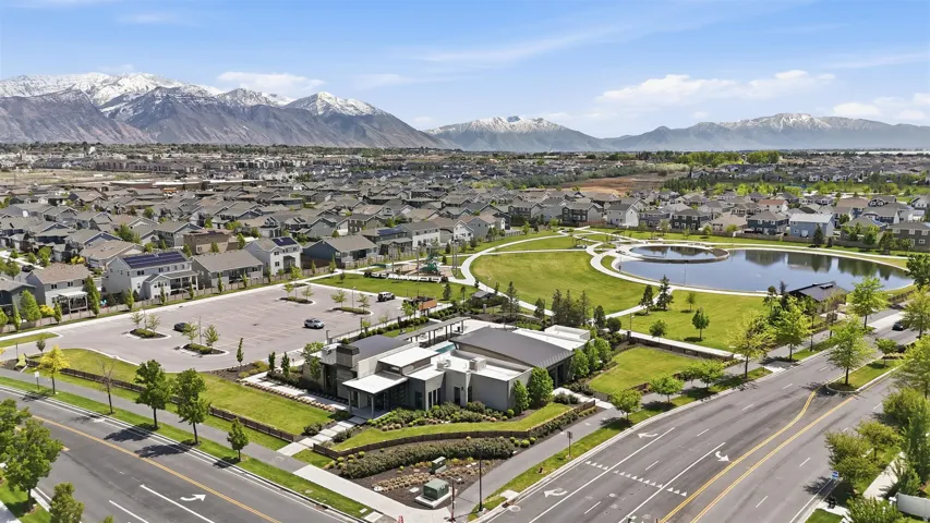 Aerial perspective of suburban area with a water and mountain view