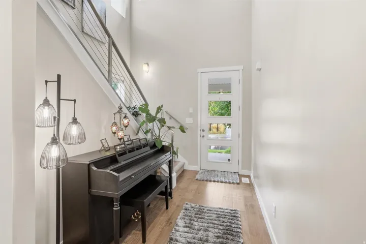 Entryway featuring a high ceiling and light wood-type flooring