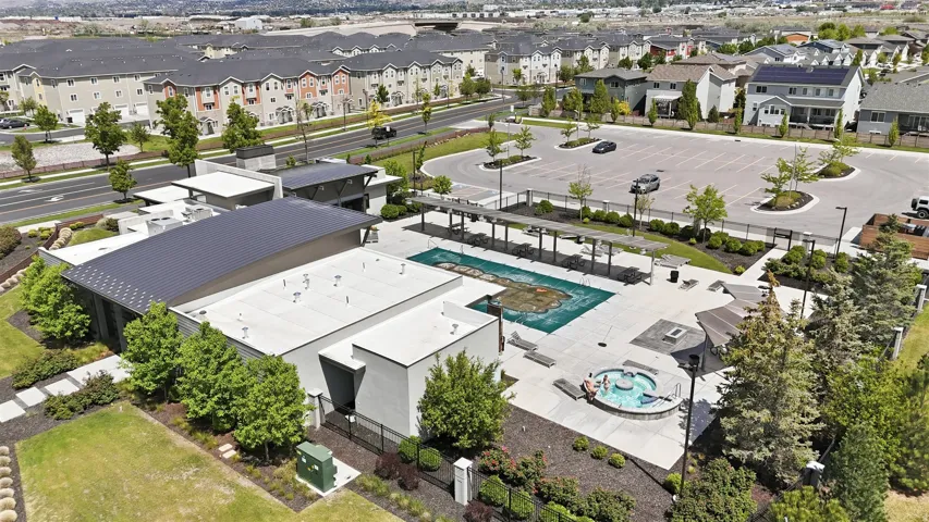 Aerial view of residential area featuring a pool