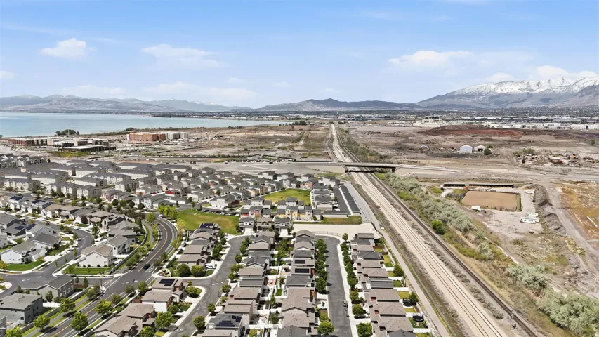 Aerial perspective of suburban area featuring a water and mountain view