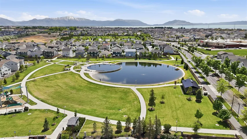 Aerial perspective of suburban area featuring a water and mountain view