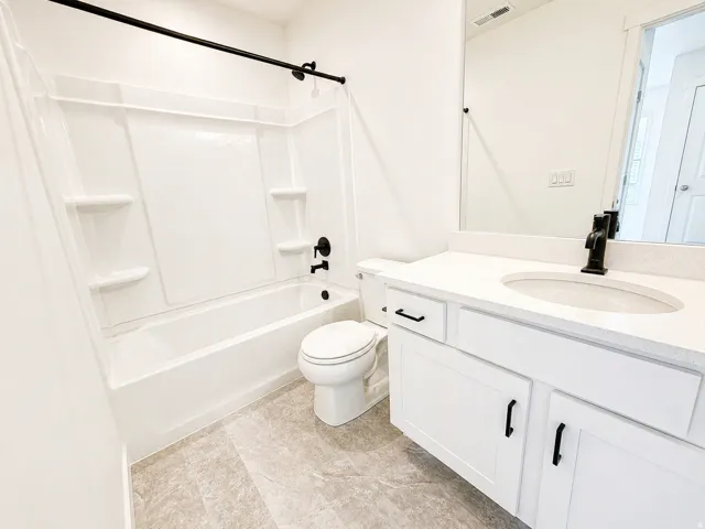 Full bath featuring vanity and tub / shower combination