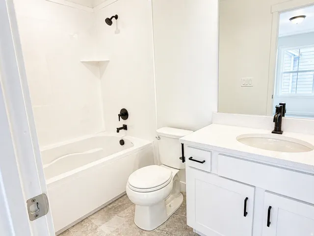 Full bathroom with vanity and tub / shower combination