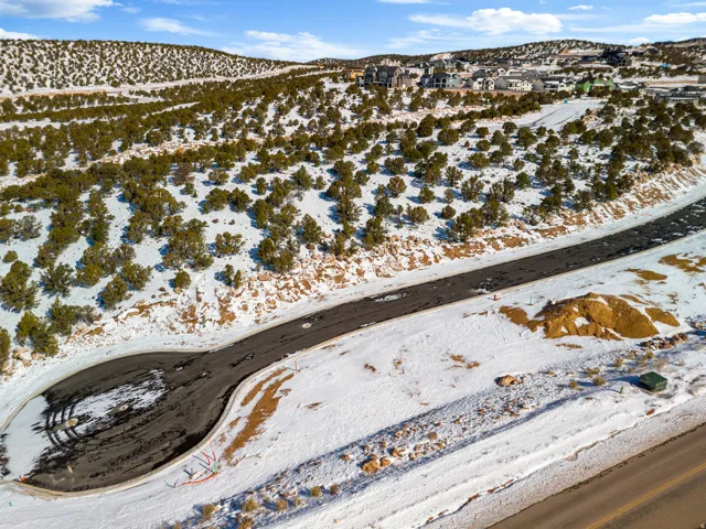 Snowy aerial view featuring a mountain view