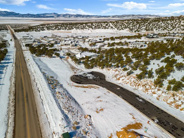 Snowy aerial view featuring a mountain view
