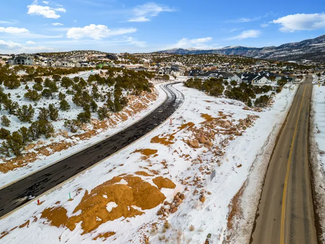 Snowy aerial view with a residential view and a mountain view
