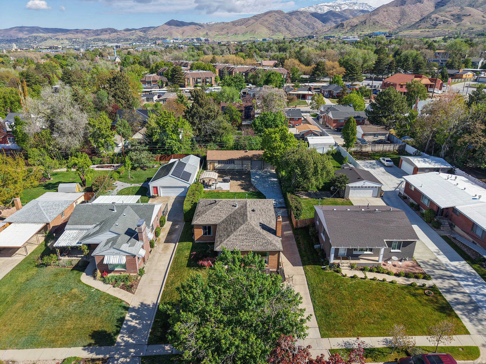 Aerial perspective of suburban area featuring a mountainous background