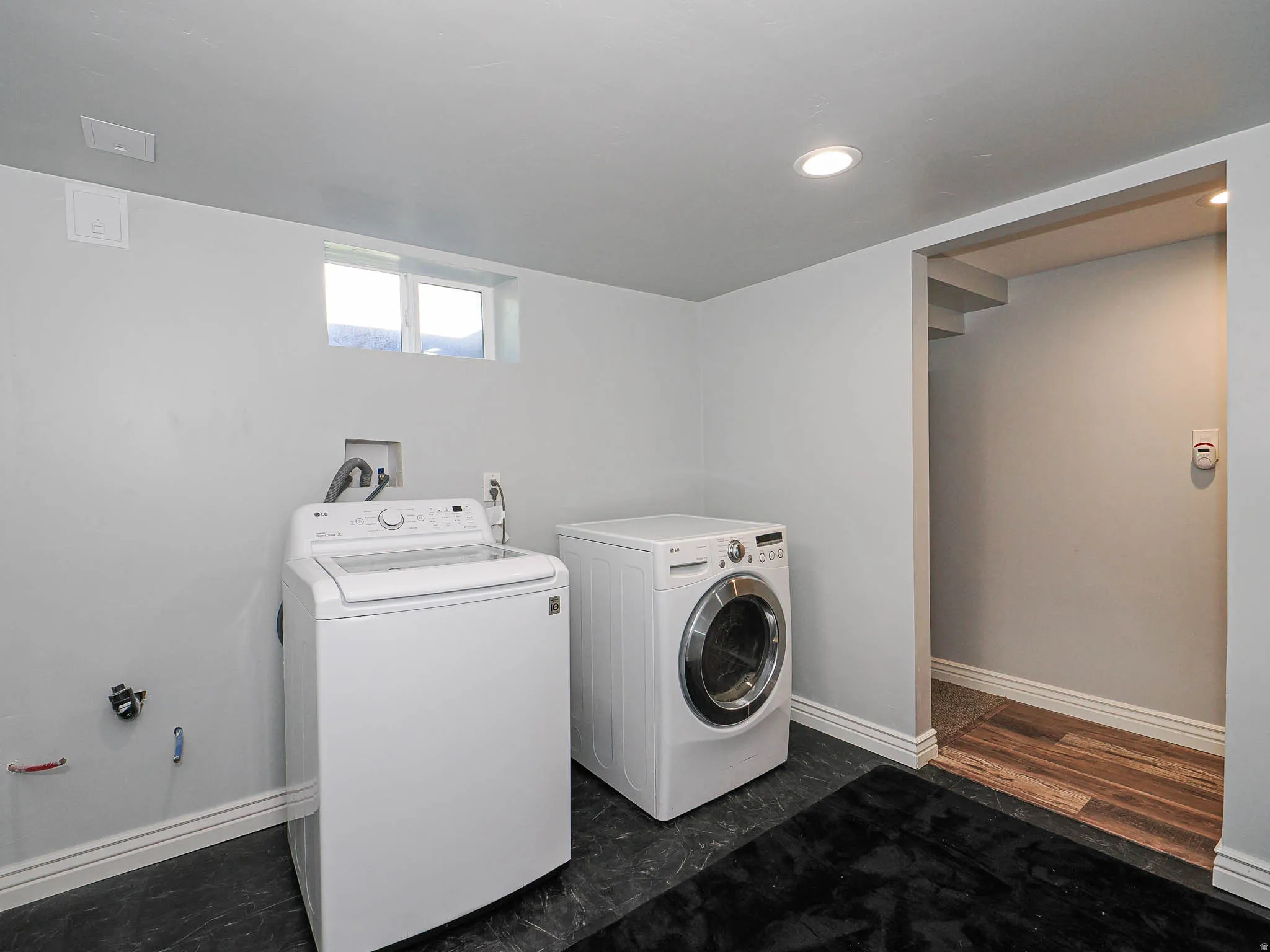 Laundry room featuring separate washer and dryer and recessed lighting