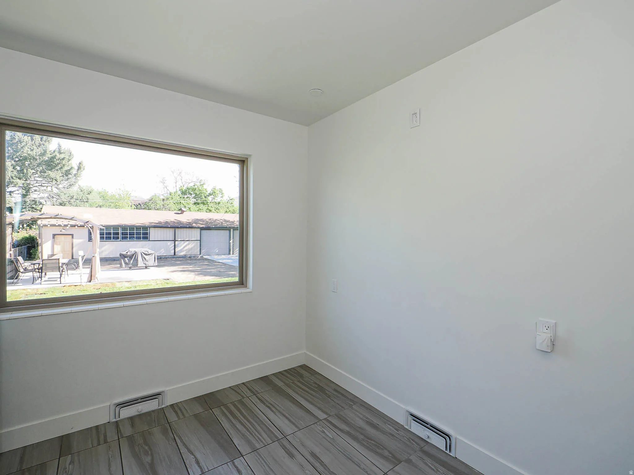 Unfurnished room featuring baseboards