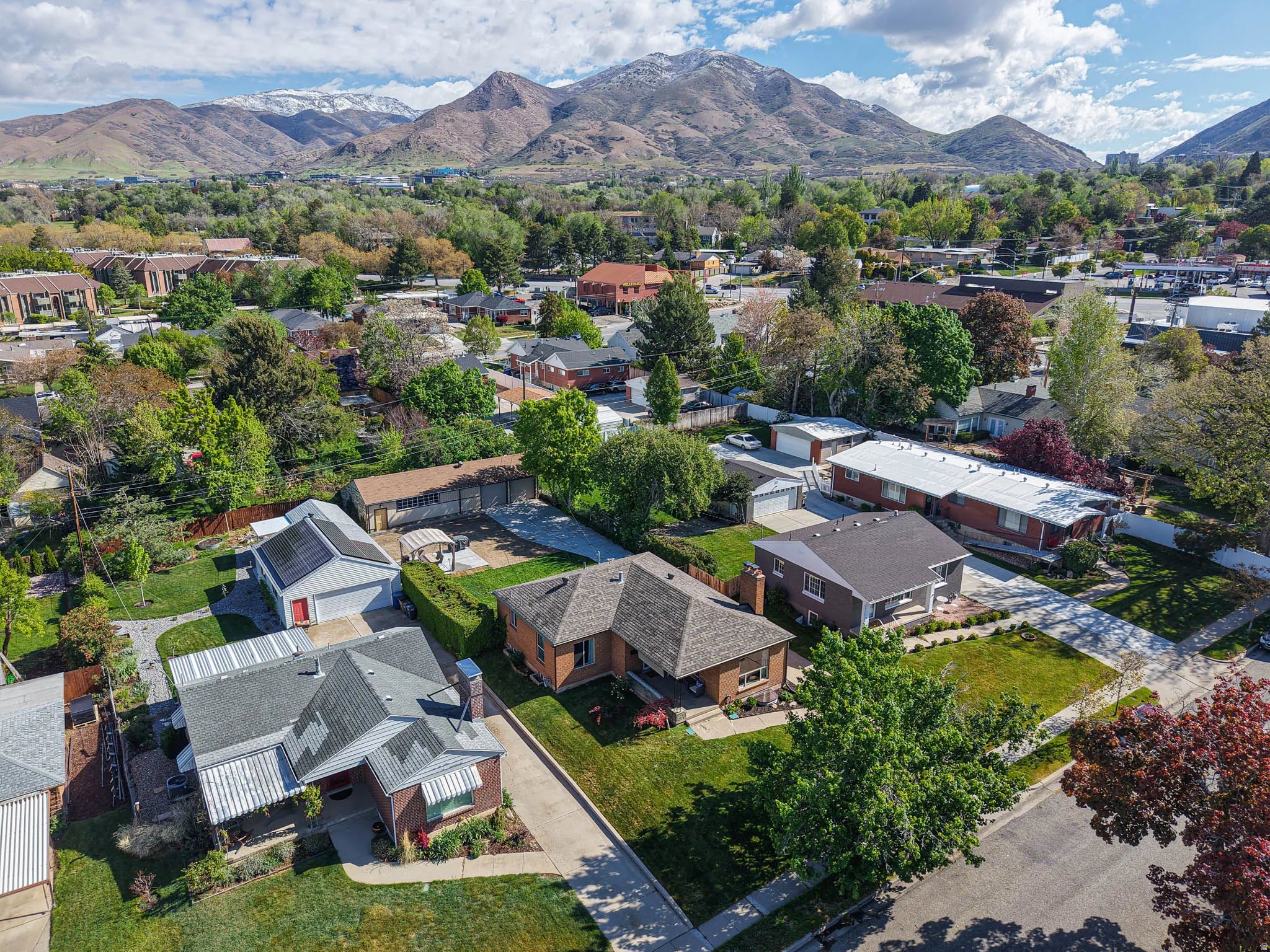 Aerial perspective of suburban area with a mountain backdrop