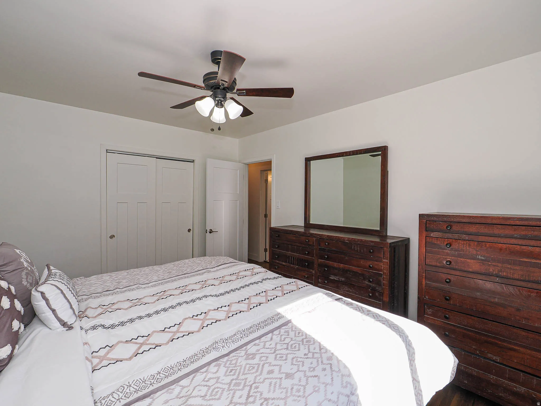 Bedroom featuring a closet and ceiling fan
