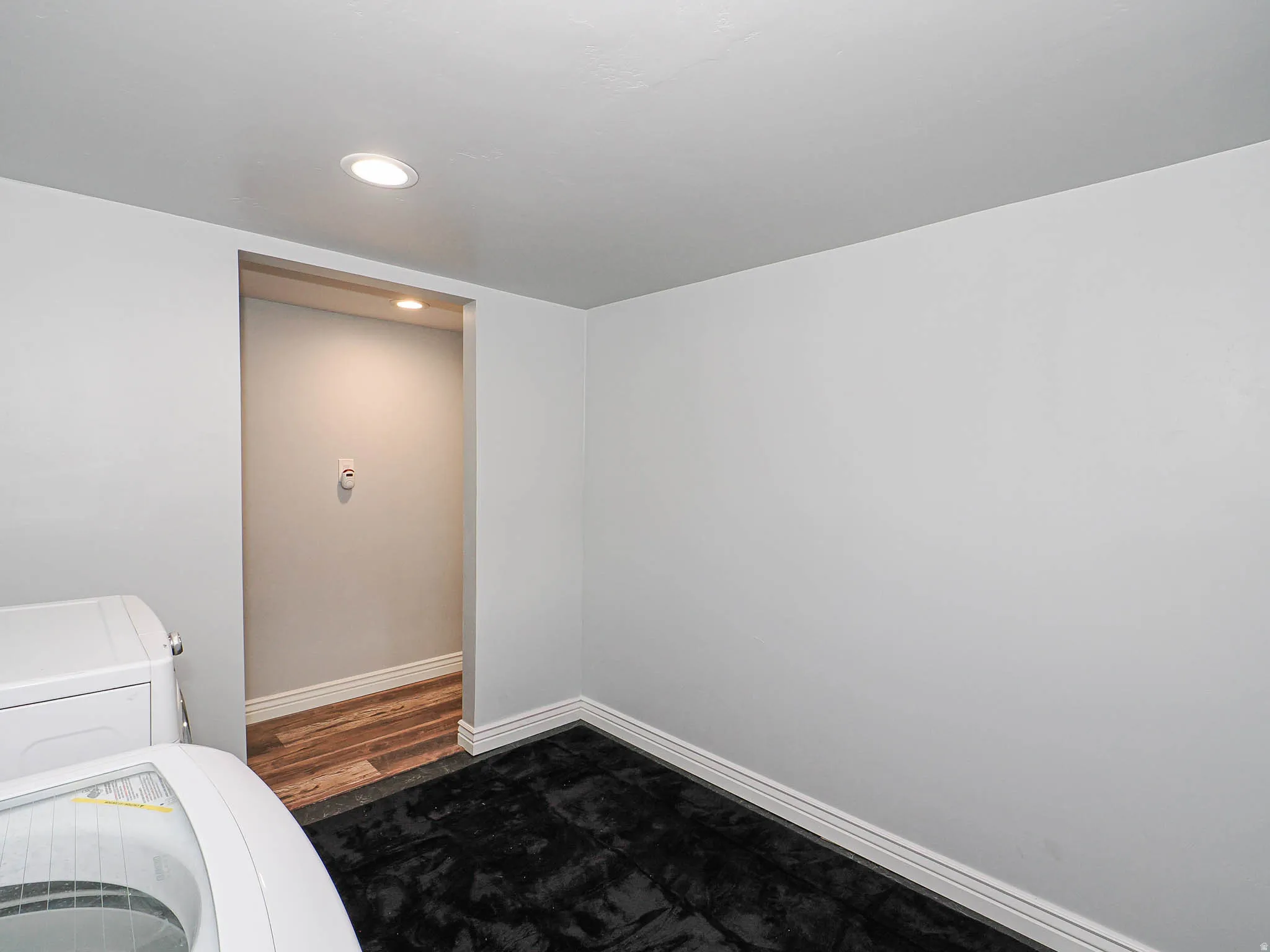 Laundry area with recessed lighting and washing machine and dryer