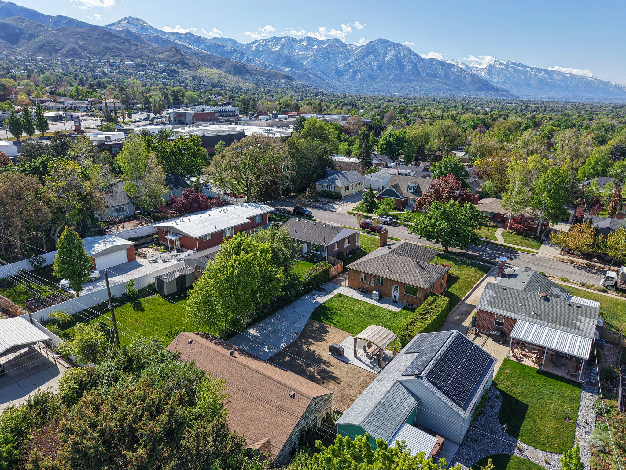Aerial perspective of suburban area featuring a mountainous background
