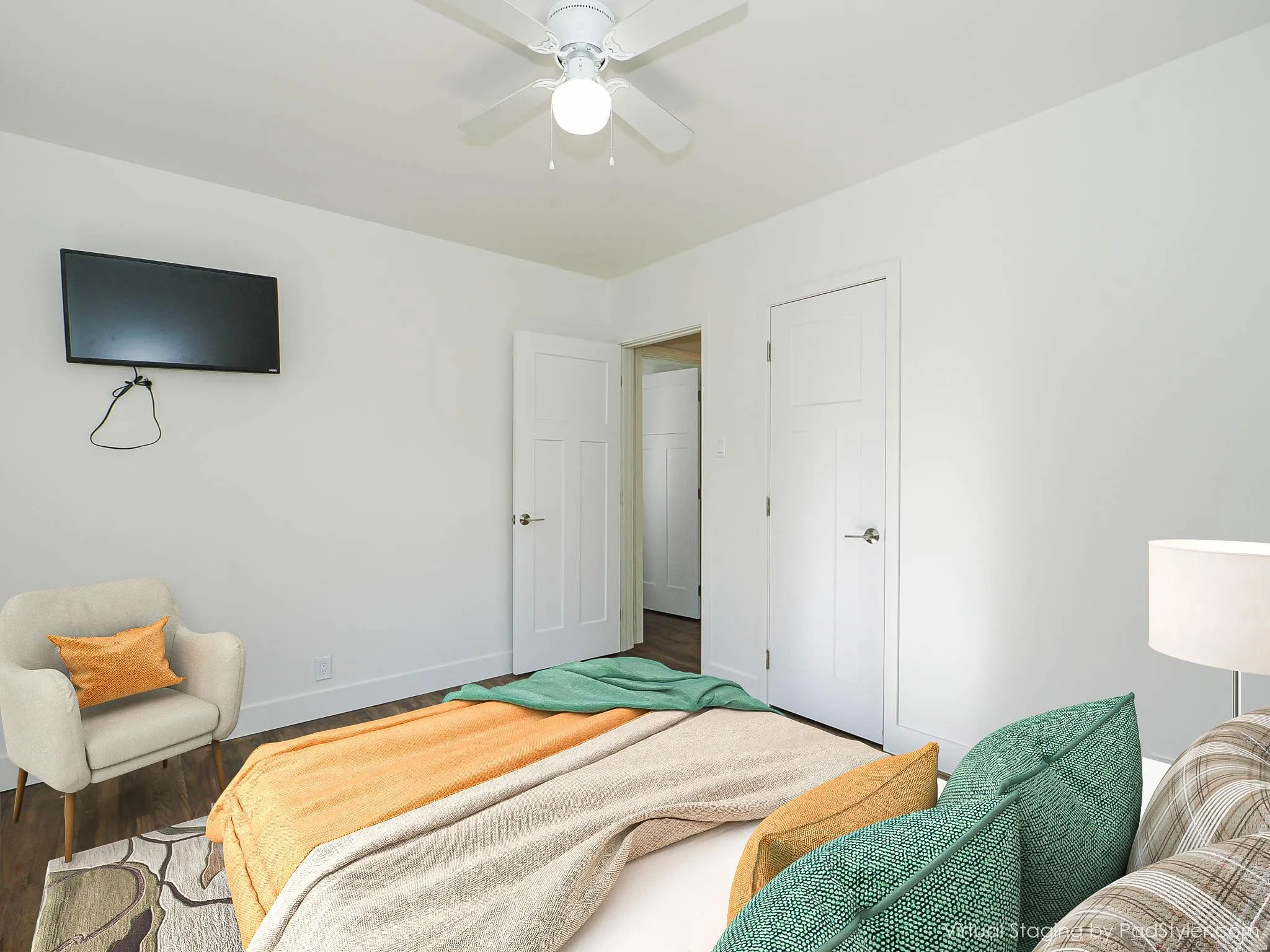 Bedroom featuring ceiling fan and wood finished floors