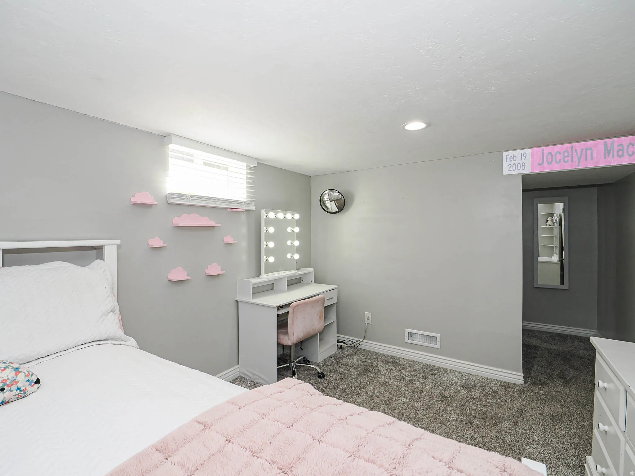 Bedroom with carpet flooring and baseboards