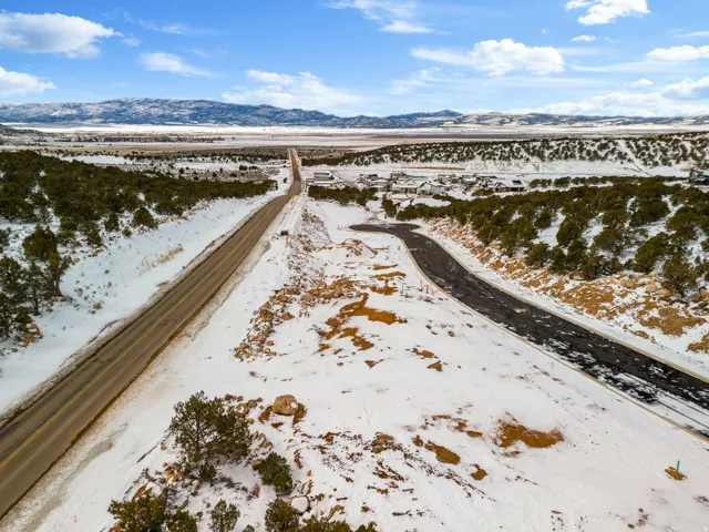 Snowy aerial view featuring a mountain view