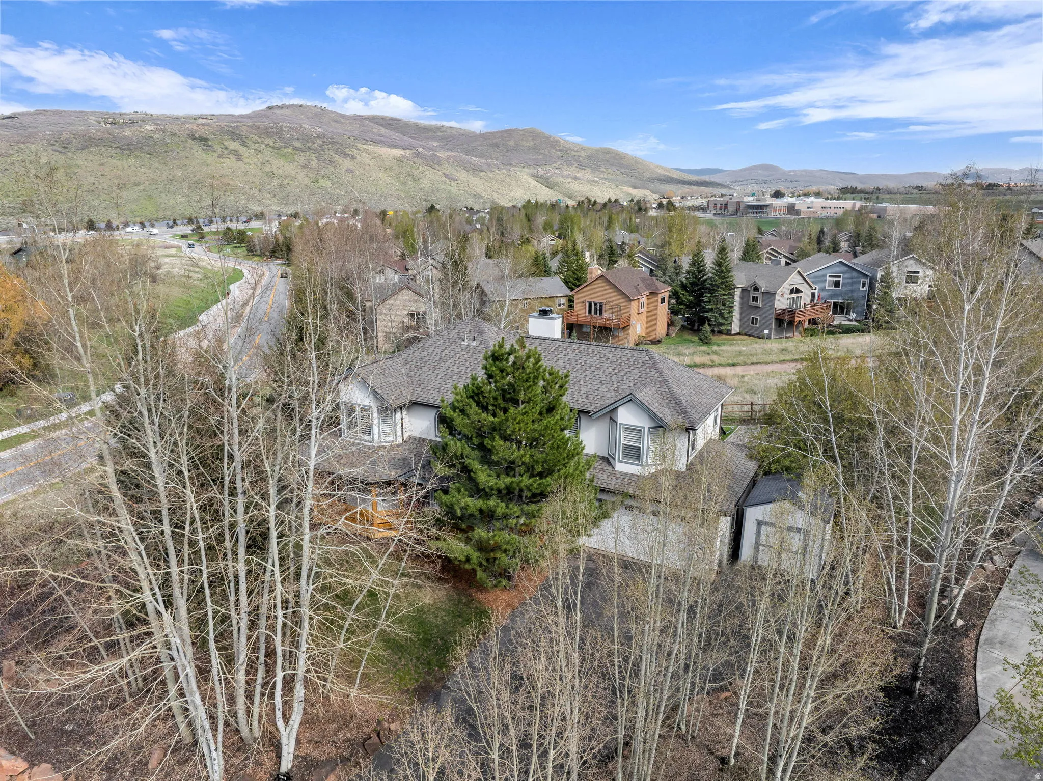 Aerial view of residential area featuring a mountainous background