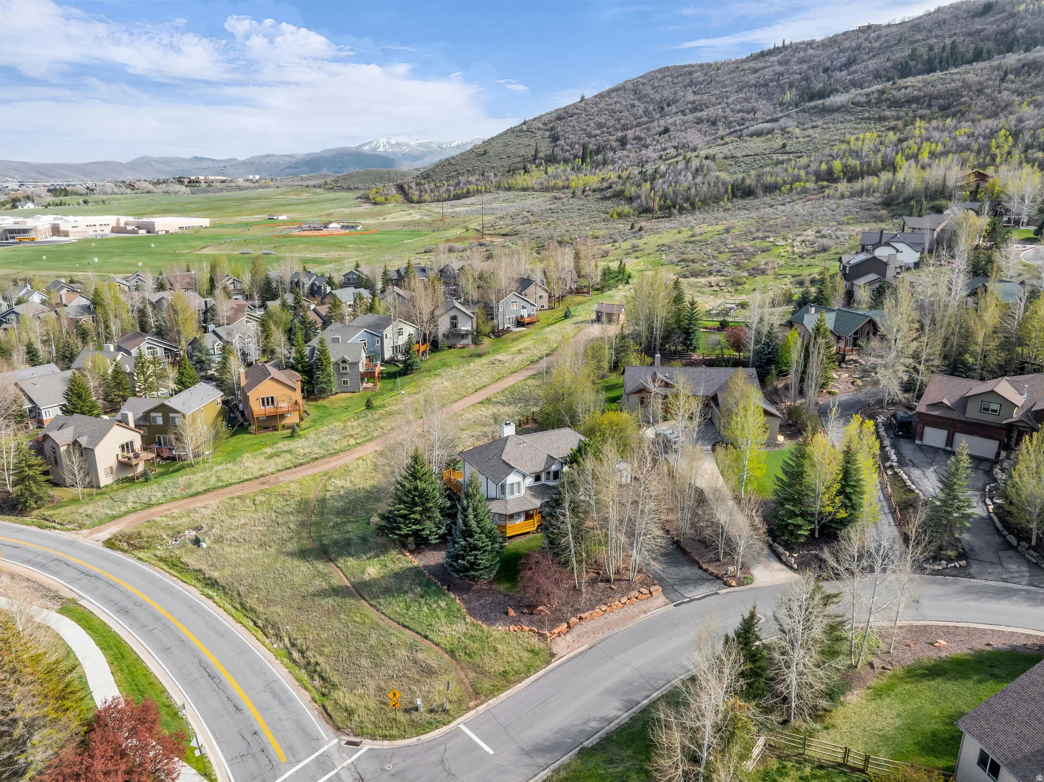 Aerial view of residential area with a mountainous background