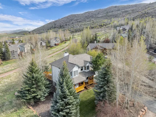 Aerial perspective of suburban area with a mountain backdrop