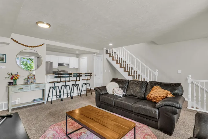 Living room featuring light carpet and recessed lighting