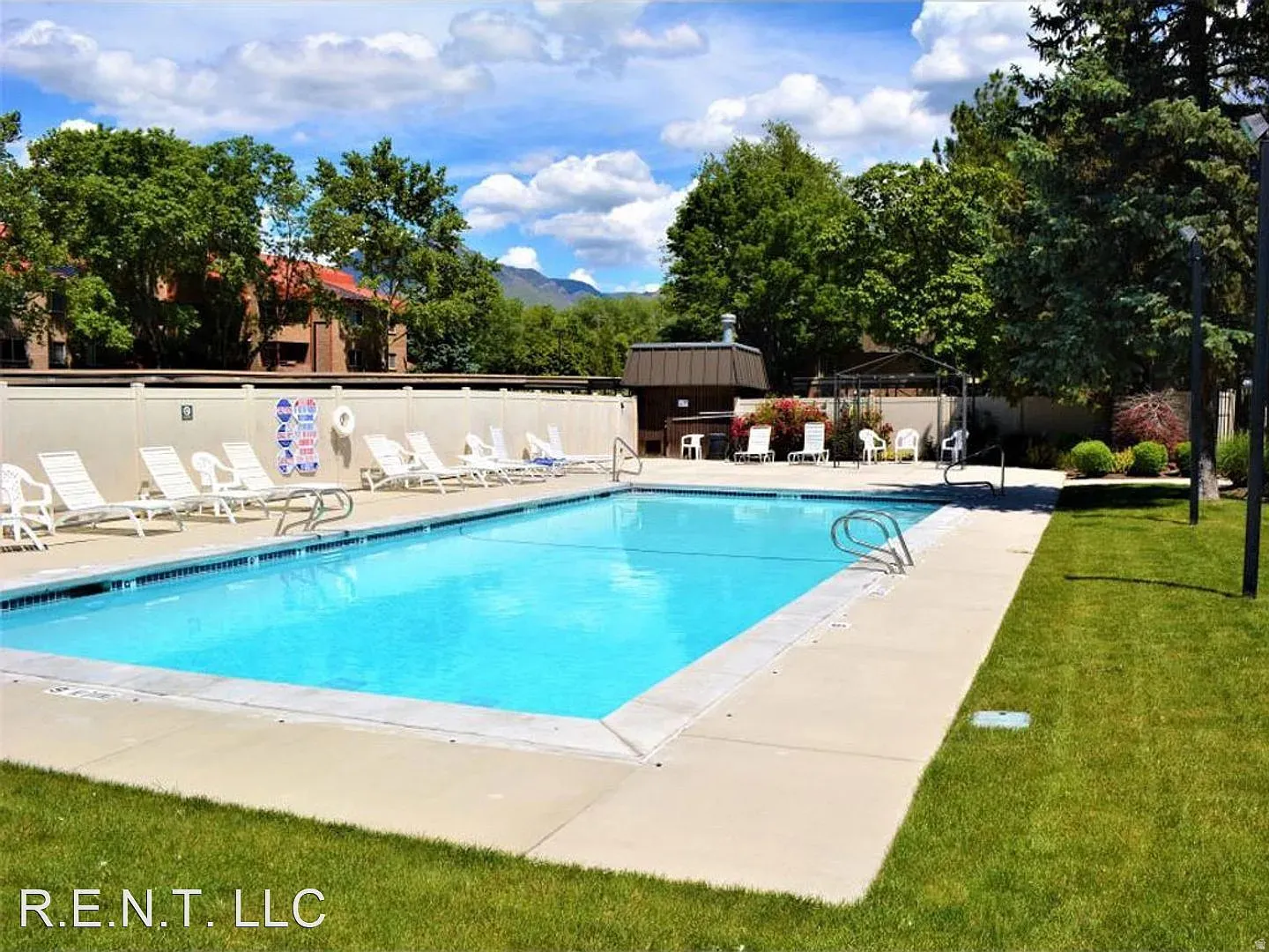 Community pool with a patio