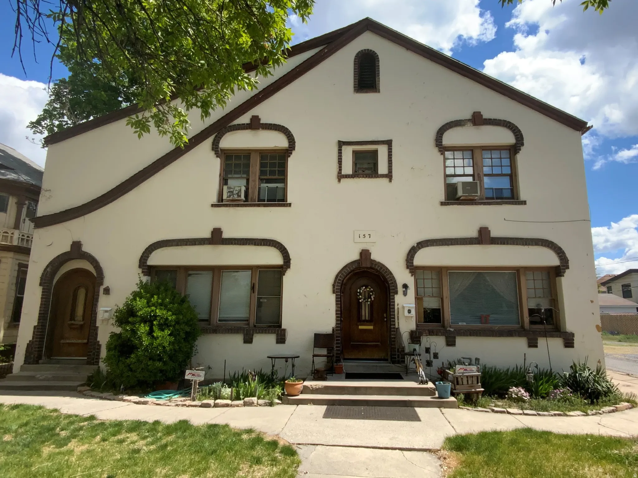Mediterranean / spanish-style home with stucco siding and a front yard