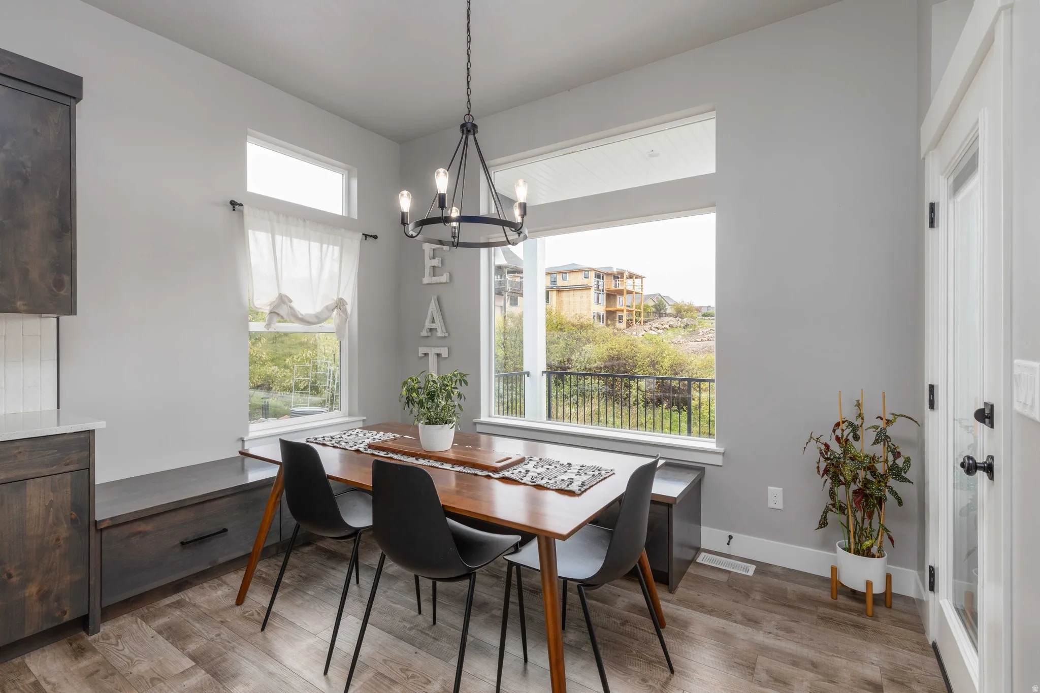 Dining space with a chandelier and light wood-style flooring
